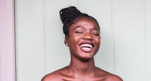 african woman laughing