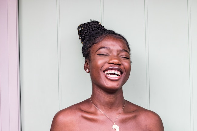 african woman laughing